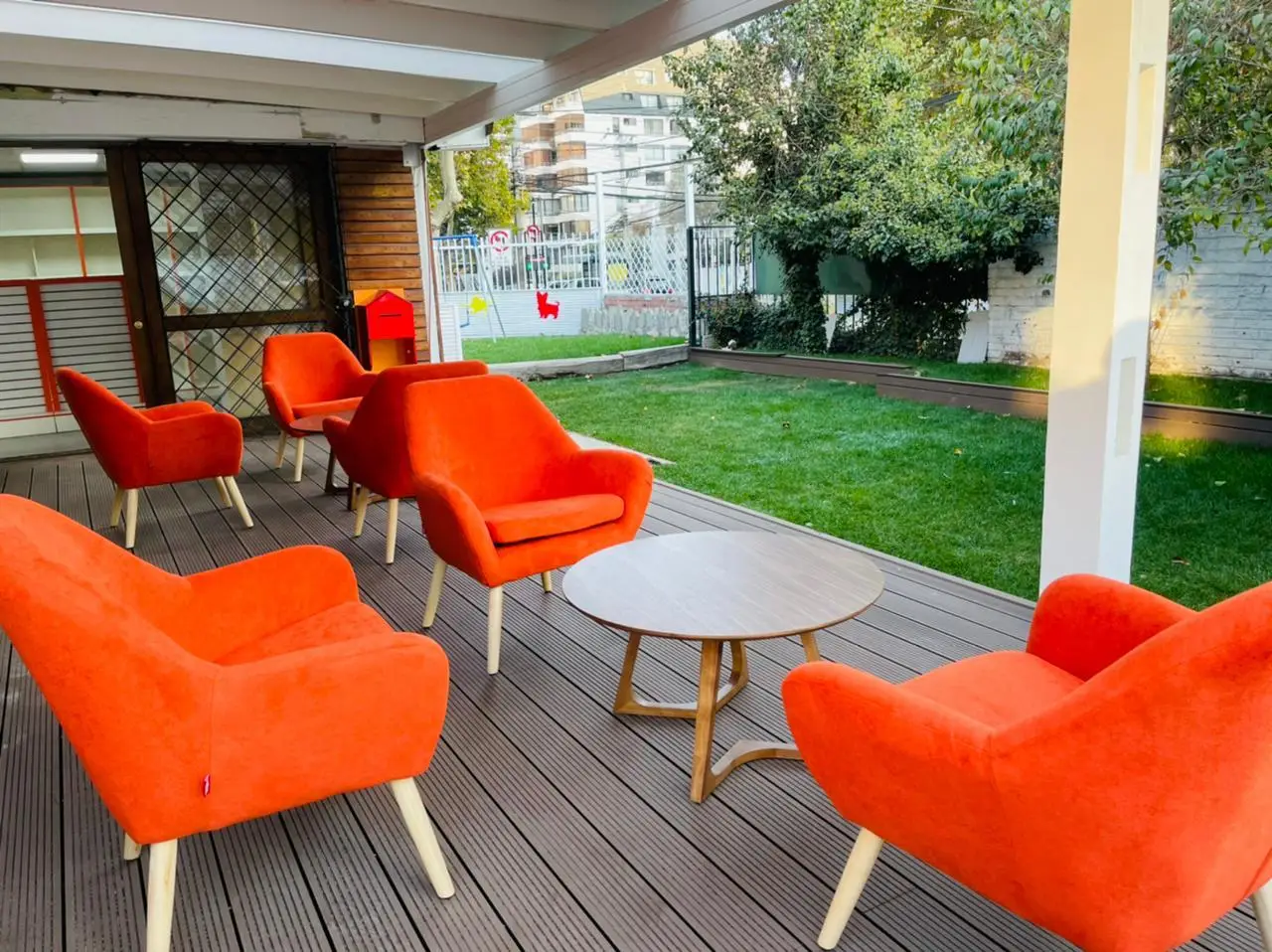 a group of chairs and a table on a porch